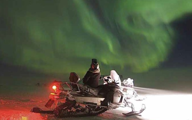 Northern Lights on Snowmobile